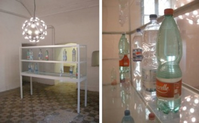 Tue Greenfort, detail of Condensazione, 2008, dehumidifier, vitrine with plastic bottles, water, variable dimensions (courtesy of the artist, Fondazione Morra Greco, Napoli, and Johann König, Berlin)